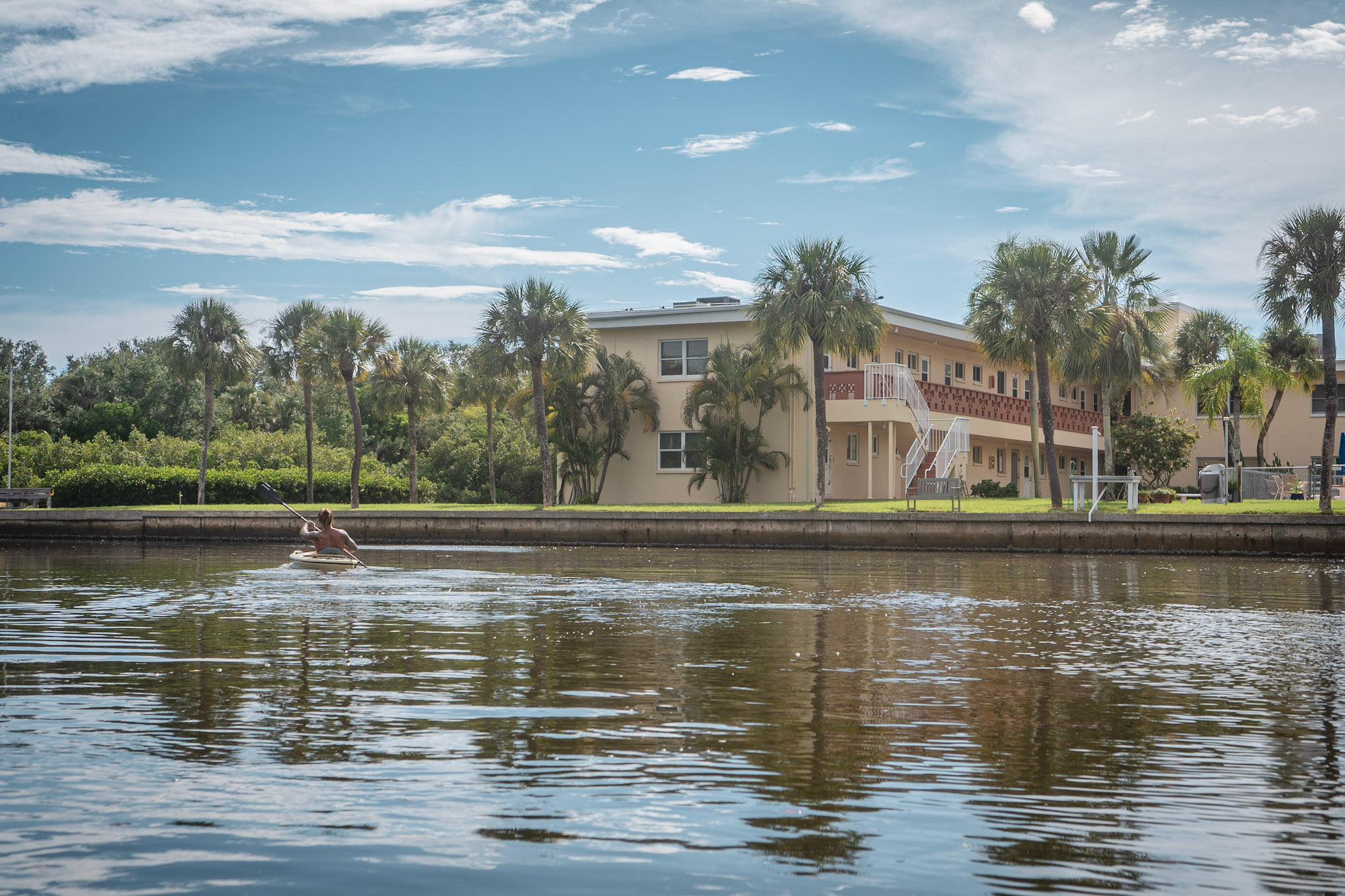 Kayaker paddling out from under a bridge